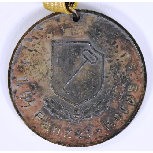 316 - A WWII Second World War Third Reich Nazi German 1st SS Panzer Sports Day medallion. Suspended on red... 