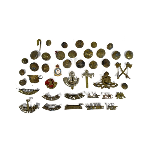 323 - A collection of WWII Second World War and other Military cap badges and uniform buttons to include; ... 