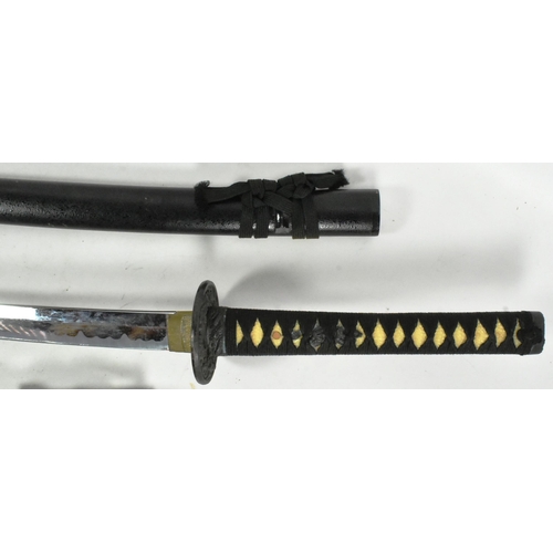 327 - A 20th Century Japanese Katana and Wakizashi sword. Both with celluloid grips bound with black rope ... 