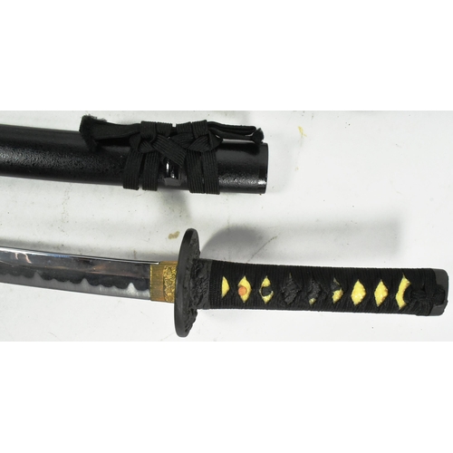 327 - A 20th Century Japanese Katana and Wakizashi sword. Both with celluloid grips bound with black rope ... 