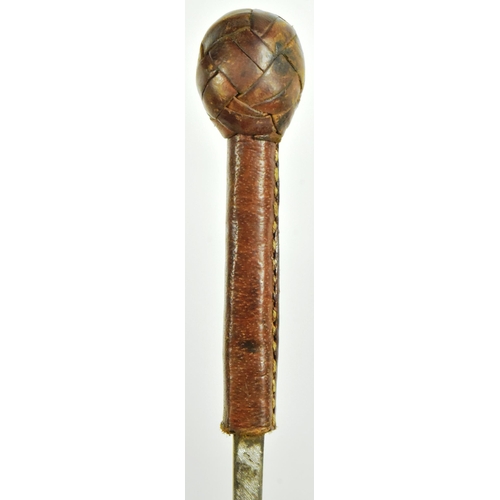 34 - A leather lined cosh weapon with an iron ball pommel covered with plaited leather and a concealed sq... 