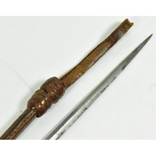 34 - A leather lined cosh weapon with an iron ball pommel covered with plaited leather and a concealed sq... 