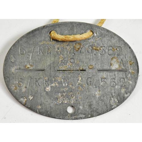 346 - A WWII Second World War Third Reich Nazi German dog tag for an Infantry Driver. Housed in a small ha... 