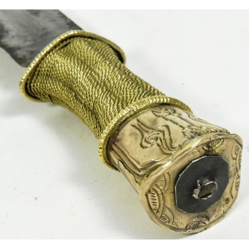 359 - A late 19th Century Tibetan /  Bhutanese dagger. White metal filigree handle with a single edged bla... 