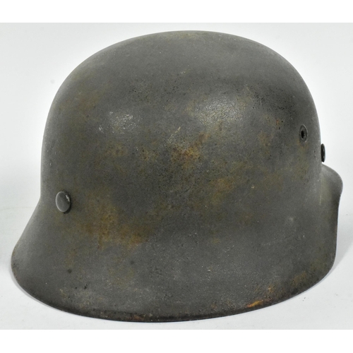 361 - An original WWII Second World War Third Reich Nazi German M40 Stahlhelm steel combat helmet. A singl... 