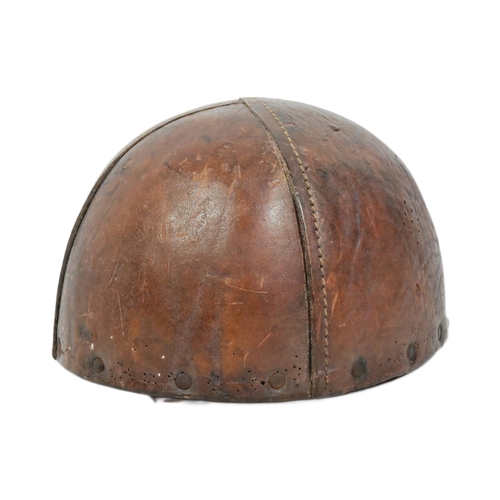 37 - A WWII Second World War Dispatch Riders motorcycle crash helmet. Thick brown leather and cork constr... 