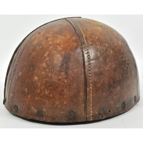 37 - A WWII Second World War Dispatch Riders motorcycle crash helmet. Thick brown leather and cork constr... 