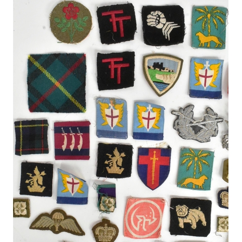 371 - A large collection assorted WWII Second World War and later military cap badges, uniform buttons, me... 