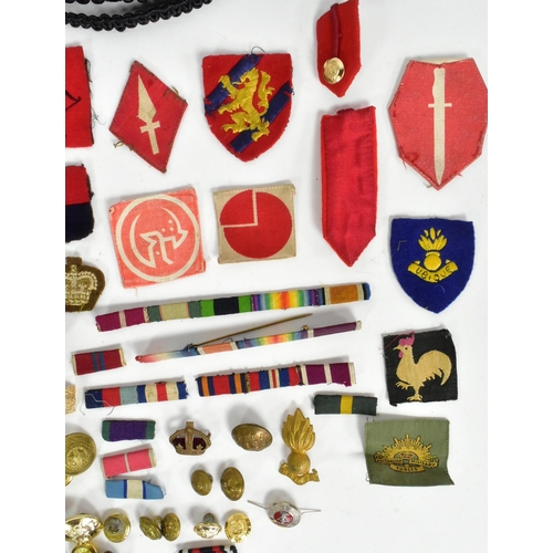 371 - A large collection assorted WWII Second World War and later military cap badges, uniform buttons, me... 