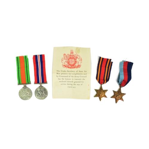 38 - A WWII Second World War medal group comprising British War medal, Defence medal, 1939-45 Star and Bu... 