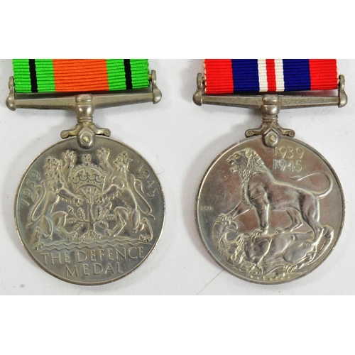 38 - A WWII Second World War medal group comprising British War medal, Defence medal, 1939-45 Star and Bu... 