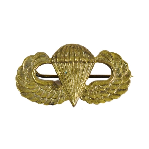 388 - A WWII Second World War Australian made US United States Paratroopers Wings badge. Makers mark to ve... 