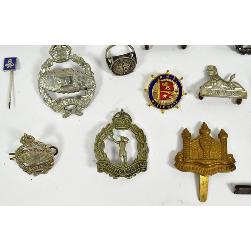 393 - A collection of WWII Second World War British Army cap badges and medals to include; 1939-45 Star, I... 