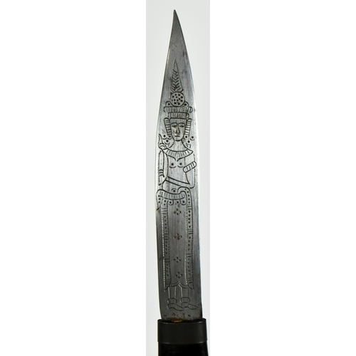 418 - A mid 20th Century South East Asian ( Cambodia ) horn hilted dagger. The elongated grip carved and i... 