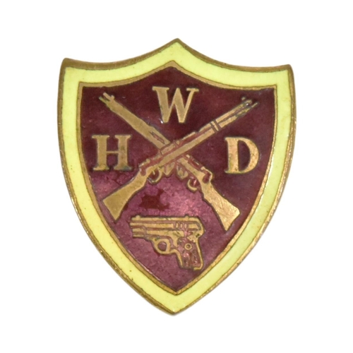 48 - A WWII Second World War WHD Women's Home Defence Guard enamel pin badge. Yellow bordered maroon shie... 