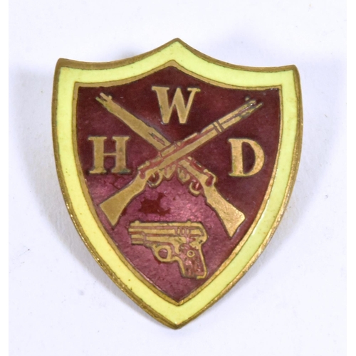 48 - A WWII Second World War WHD Women's Home Defence Guard enamel pin badge. Yellow bordered maroon shie... 