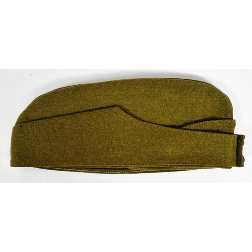 49 - A WWI First World War RFC Royal Flying Corps officers uniform side cap. The khaki cap with metal Kin... 