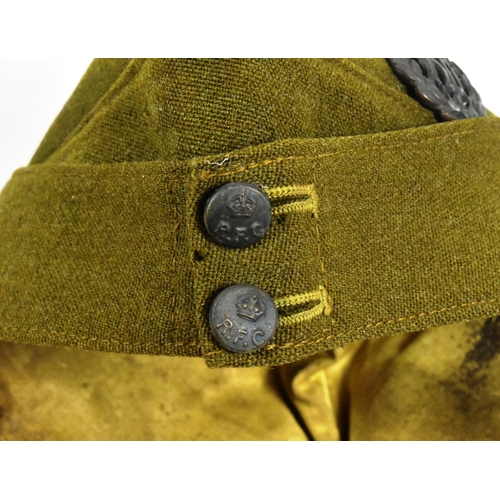 49 - A WWI First World War RFC Royal Flying Corps officers uniform side cap. The khaki cap with metal Kin... 