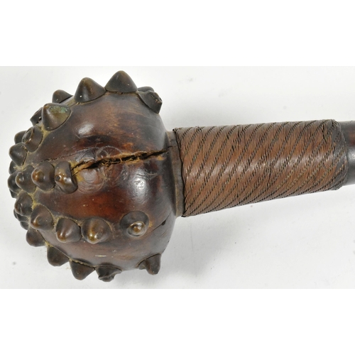 8 - A 19th Century South African Zulu Knobkerrie mace. Hardwood throwing stick with crossed metal studs ... 