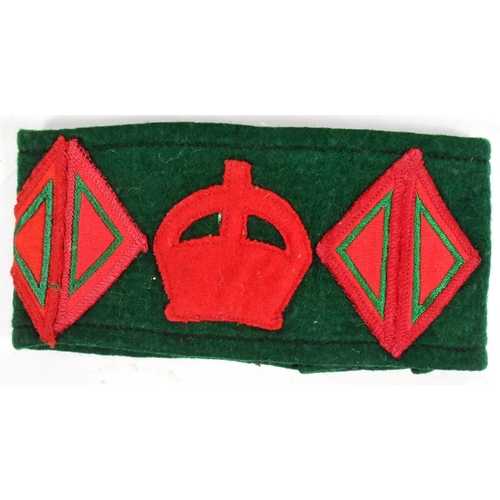 82 - Two WWII Second World War WLA Women's Land Army uniform armbands. Green with red felt patches and bu... 