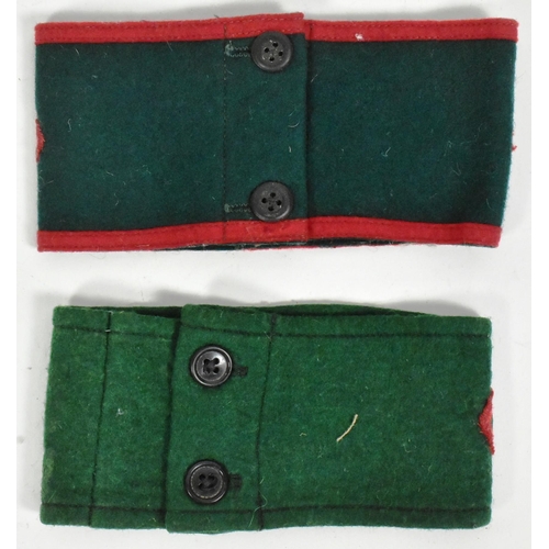 82 - Two WWII Second World War WLA Women's Land Army uniform armbands. Green with red felt patches and bu... 