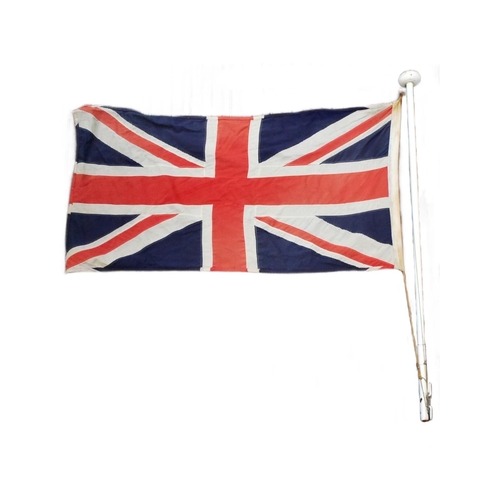 88 - A large British Union Jack linen flag with wooden flag pole and hoist. Flag measures approx 67x125cm... 