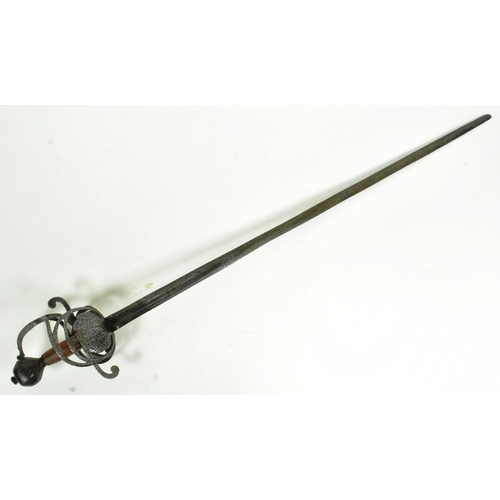 96 - An early 17th Century English riding sword. Rapier style hilt with two scalloped shell guards and a ... 