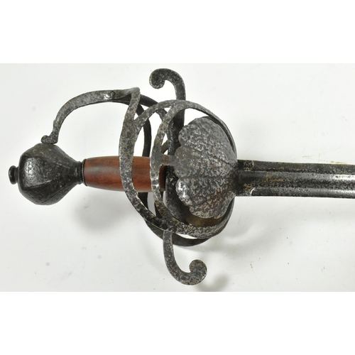 96 - An early 17th Century English riding sword. Rapier style hilt with two scalloped shell guards and a ... 