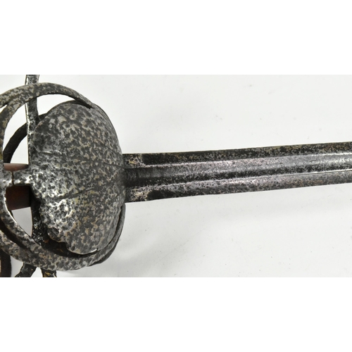 96 - An early 17th Century English riding sword. Rapier style hilt with two scalloped shell guards and a ... 