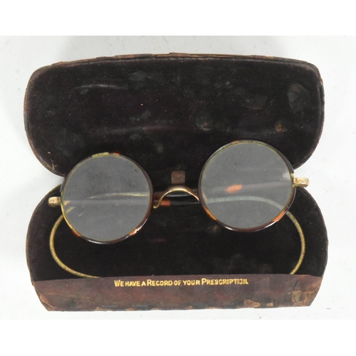 400 - Mahatma Gandhi (1869-1948) - a pair of mid-20th century c1940s gold plated and faux tortoise shell W... 