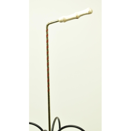 106 - A retro 20th century wire worked stick stand in the form of an umbrella. The stand having a small ba... 