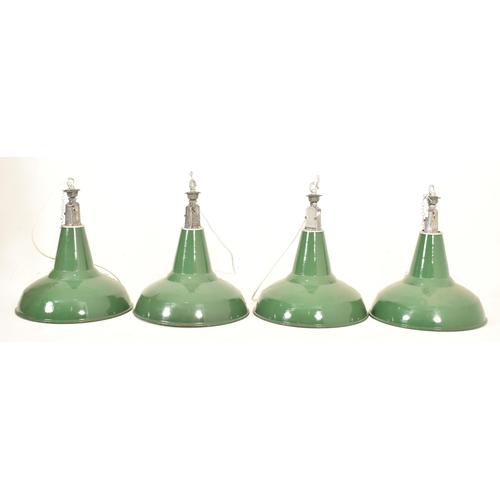 115 - A matching set of four retro 20th century industrial porcelain enamel pendant ceiling lights. Each l... 