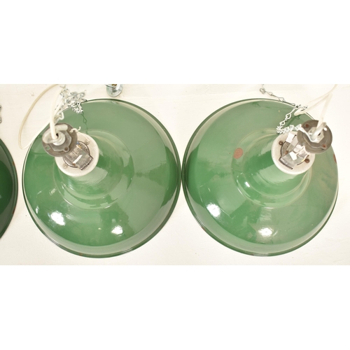 115 - A matching set of four retro 20th century industrial porcelain enamel pendant ceiling lights. Each l... 