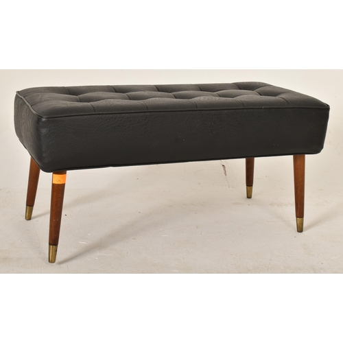 126 - A vintage mid 20th century leatherette and teak footstool. The stool with leatherette button back up... 