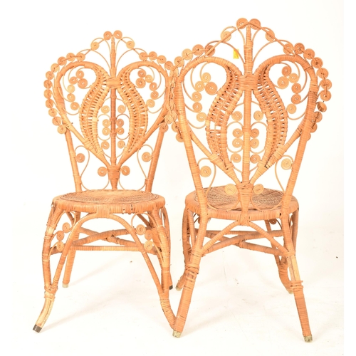 138 - Pons Leyva - A pair of retro mid 20th century Spanish bamboo and wicker woven peacock chairs. Each c... 
