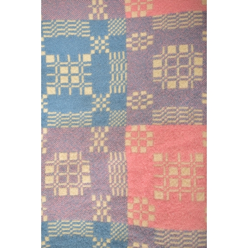 144 - A 20th century hand made woollen traditional Welsh blanket. The blanket throw in pink, Blue and purp... 