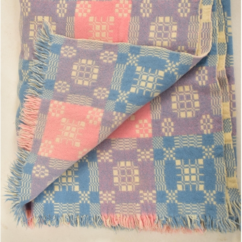 144 - A 20th century hand made woollen traditional Welsh blanket. The blanket throw in pink, Blue and purp... 