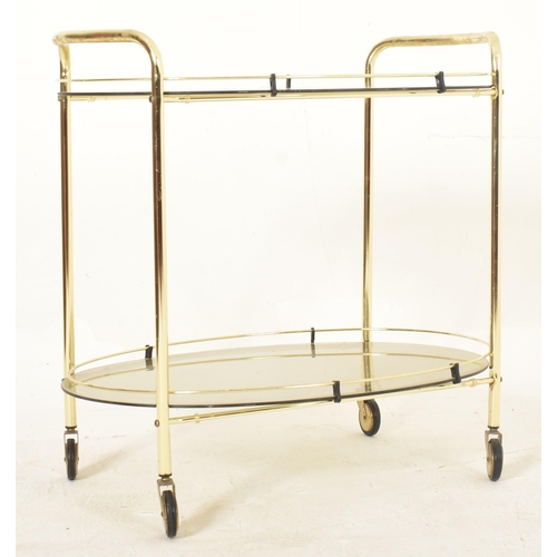 164 - A vintage 20th century 1970s Italian style smoked glass drinks / cocktail trolley. The trolley of ov... 