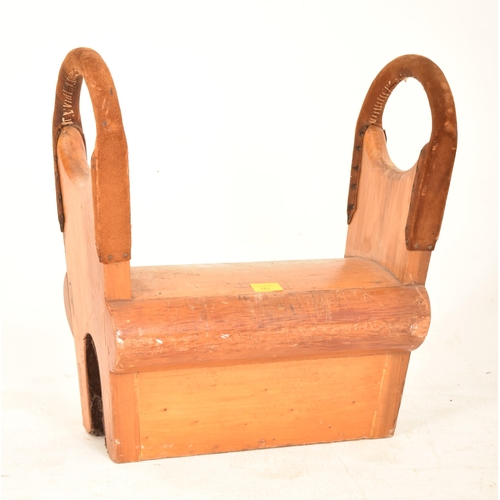 181 - A vintage mid 20th century oak gymnastics Pommel Horse / Saddle. Typical form with suede covered hoo... 