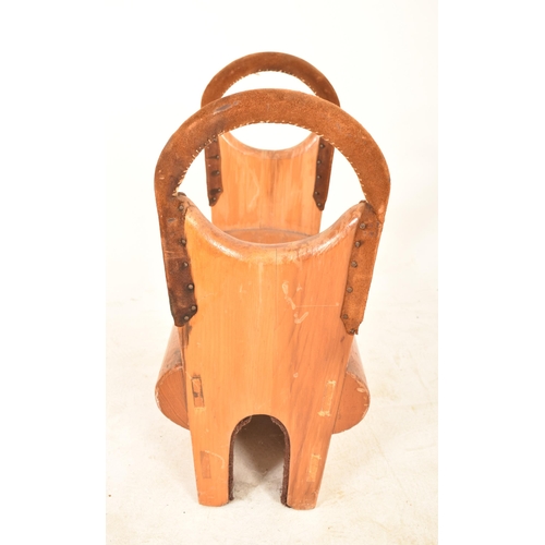 181 - A vintage mid 20th century oak gymnastics Pommel Horse / Saddle. Typical form with suede covered hoo... 