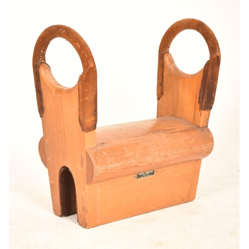 181 - A vintage mid 20th century oak gymnastics Pommel Horse / Saddle. Typical form with suede covered hoo... 