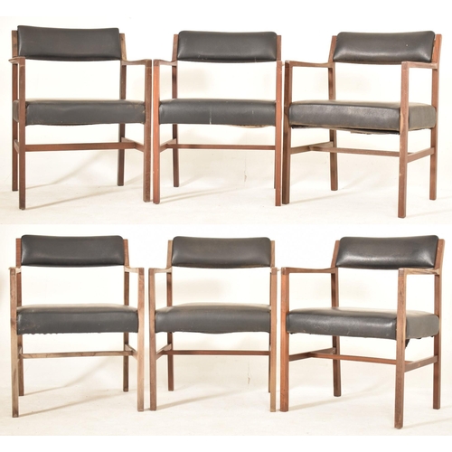 203 - Alfred Cox - A set of six 1970s teak wood dining chairs / office chairs. The chairs having curved ar... 