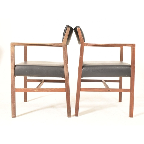 203 - Alfred Cox - A set of six 1970s teak wood dining chairs / office chairs. The chairs having curved ar... 