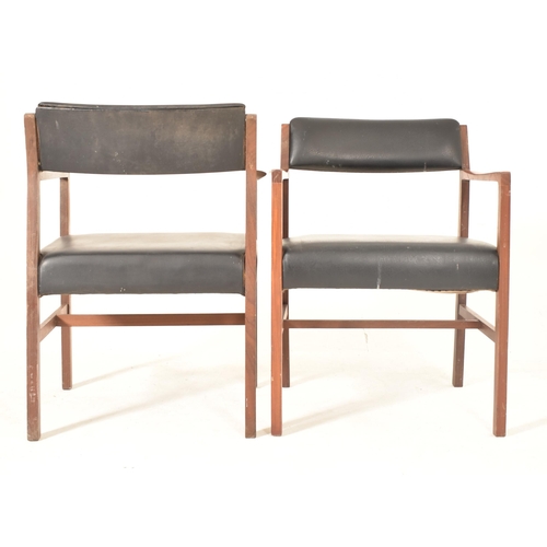 203 - Alfred Cox - A set of six 1970s teak wood dining chairs / office chairs. The chairs having curved ar... 