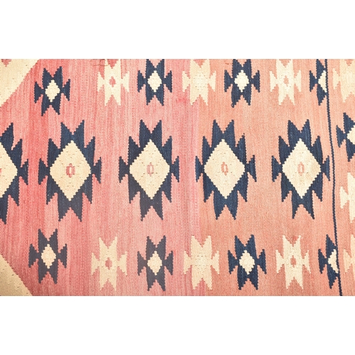 220 - A vintage 1980s South West Turkey imported by Rufus Reade for Out of The Nomads Tent kilim. The kili... 