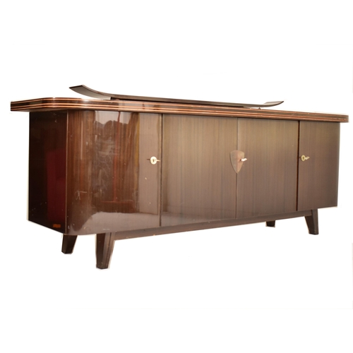 222 - A retro mid 20th century German designer sideboard credenza. The sideboard having a formica finished... 