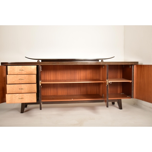 222 - A retro mid 20th century German designer sideboard credenza. The sideboard having a formica finished... 