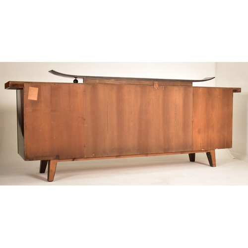 222 - A retro mid 20th century German designer sideboard credenza. The sideboard having a formica finished... 