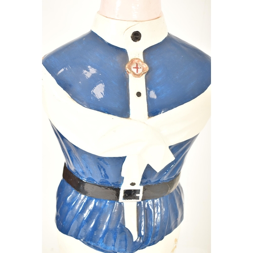 23 - A vintage 20th century painted fiberglass torso shop display / point of sale mannequin. The mannequi... 