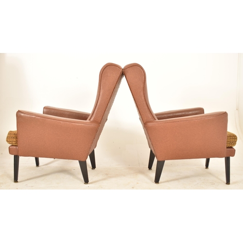 232 - A retro 20th century faux tan brown leather sofa suite. The suite comprising a two seater sofa sette... 